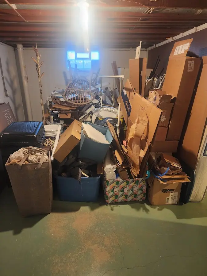 Roll-off dumpster container at job site for Yard Waste Dumpster Rental in Groton